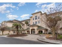 Attractive building exterior with palm tree and landscaped grounds at 2180 Waterview Dr. # 324, North Myrtle Beach, SC 29582