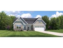 Charming two-story home with a landscaped yard and attached garage at 2230 Vera Way, Longs, SC 29568