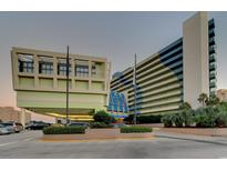 Coral Beach Resort exterior with covered entrance and parking at 1105 S Ocean Blvd. # 830, Myrtle Beach, SC 29577
