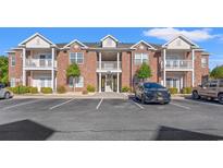Attractive two-story condo building with balconies and parking at 2005 Silvercrest Dr. # G-32, Myrtle Beach, SC 29579