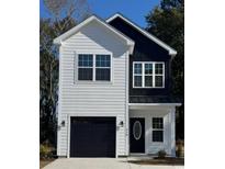 Two-story house with white and black exterior, featuring a black garage door and a charming front entrance at 210 26Th Ave. S, Myrtle Beach, SC 29577