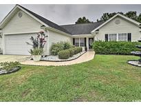 Nice curb appeal! This charming house features a well-manicured lawn and walkway at 2707 Wood Creek Ln., Conway, SC 29527