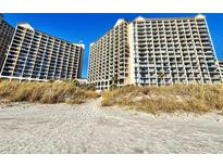 Oceanfront property with beach access, two high-rise buildings visible at 4800 S Ocean Blvd. # 611, North Myrtle Beach, SC 29582