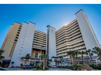 Multi-story building with oceanfront views and palm trees at 5200 N Ocean Blvd. # 1134, Myrtle Beach, SC 29577