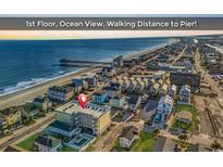 Aerial view of beachfront property, close to the pier at 301 N Waccamaw Dr. # 109, Garden City Beach, SC 29576
