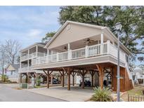 Two-story beach home with large deck and covered parking at 6001-1886 S Kings Hwy., Myrtle Beach, SC 29575