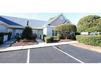 Brick front of charming house with landscaping and parking at 4530 Lighthouse Dr. # 31-C, Little River, SC 29566