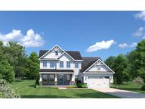 Two-story house with white siding, stone accents, and a two-car garage at 7072 Denim Loop, Myrtle Beach, SC 29579