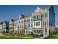 Row of charming three-story townhouses with gray, blue, and brown siding at 8411 Flamingo Ct. # 7, Myrtle Beach, SC 29572