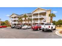 Attractive three-story building with ample parking at 5801 Oyster Catcher Dr. # 324, North Myrtle Beach, SC 29582