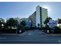 Oceanfront hotel building with palm trees and signage at 1105 S Ocean Blvd. # 334, Myrtle Beach, SC 29577