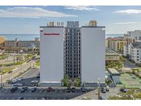 Aerial view of Holiday Towers, a high-rise building with ocean views and tennis courts at 601 Mitchell Dr. # 104, Myrtle Beach, SC 29577