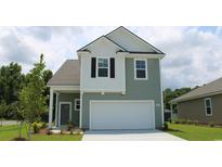 Two-story house with gray siding, white accents, and a two-car garage at 5004 Yellowstone Dr., Conway, SC 29526