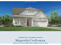 Craftsman style home with red door and white siding at 6704 Genesis Dr, Murrells Inlet, SC 29576