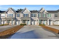 Front view of townhouses with attached garages and landscaping at 2357 Elowen Ln. # 12C, Longs, SC 29568