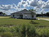 Newly built home with a landscaped lawn and driveway at Tbb13 Mineral Springs Rd., Conway, SC 29527