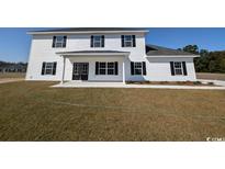 Two-story house with white siding, black windows, and a covered porch at Tbd 9 Casey Dr., Nichols, SC 29581