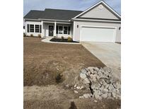 Newly constructed home with a two-car garage and well-maintained lawn at Tbd14 Mineral Springs Rd., Conway, SC 29527