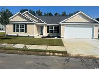 New construction home with attached garage, landscaping, and a neutral color scheme at Tbd20 Casey Dr., Nichols, SC 29581