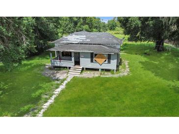 Aerial view of a fixer-upper house at 15 N Bloxham Ave, Fort Meade, FL 33841