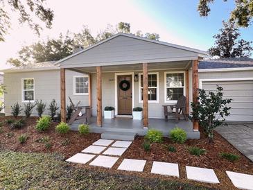 Charming curb appeal with covered front porch, landscaping, and inviting walkway at 1632 E Ridgewood St, Orlando, FL 32803