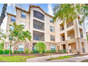 Exterior of the building with landscaping and balconies at 1301 Tuscan Ter # 9401, Davenport, FL 33896