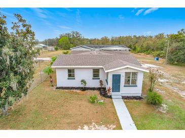 Aerial view of a single-story house with a yard at 503 Se 3Rd St, Mulberry, FL 33860