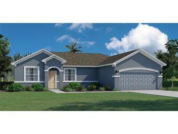 One-story home with gray exterior, two-car garage, and landscaping at 10891 Sw 41St Ave, Ocala, FL 34476