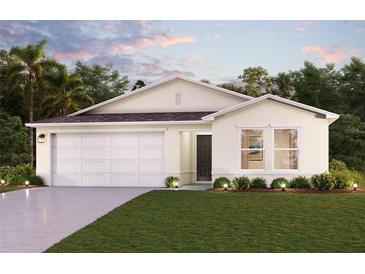 Charming single-story home with a two-car garage and inviting landscaping at 3453 Dahlia Dr, Lake Hamilton, FL 33851
