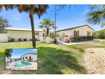 Newly renovated home with a modern exterior and a private pool at 3120 John Anderson Dr, Ormond Beach, FL 32176