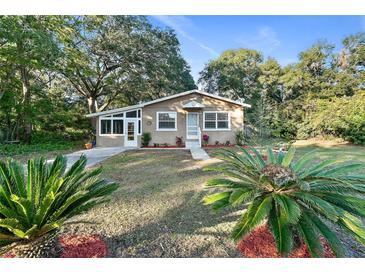 Cute single story home with mature landscaping and a large front yard at 1115 E Hubbard Ave, Deland, FL 32724