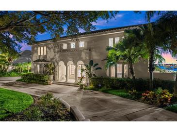 Beautiful waterfront home with lush landscaping at 70 Riverside Dr, Ormond Beach, FL 32176