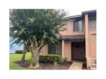 Two-story townhome with mature landscaping at 129 Blue Heron Dr # A, Daytona Beach, FL 32119