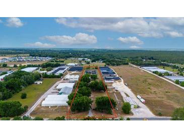 Aerial view of a rectangular lot near greenhouses at 2103 W Kelly Park Rd, Apopka, FL 32712