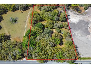 Aerial view of wooded lot at 26711 County Road 33, Groveland, FL 34736