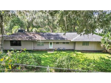 Single-story home with a large backyard at 3230 Cr 421, Lake Panasoffkee, FL 33538