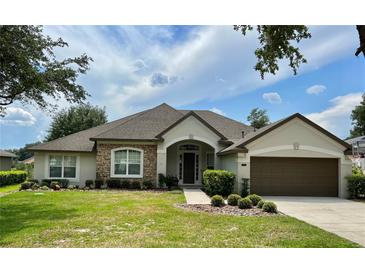 Single-Gathering home with attractive landscaping and two-car garage at 32313 Oak Canopy Dr, Sorrento, FL 32776