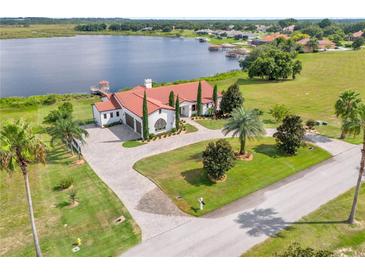 Luxury waterfront home with large backyard and pool at 7616 Lily Ct, Groveland, FL 34736