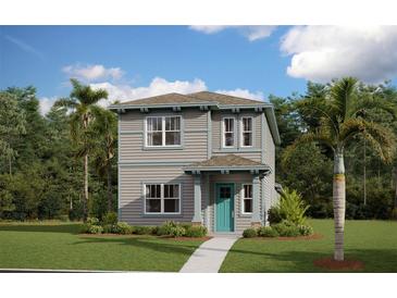 Two-story home with teal door and landscaping at 3106 Voyager Ave, Saint Cloud, FL 34771