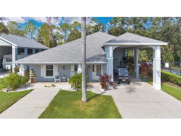 Single-story home with carport and landscaped yard at 16345 Citrus Pkwy, Clermont, FL 34714