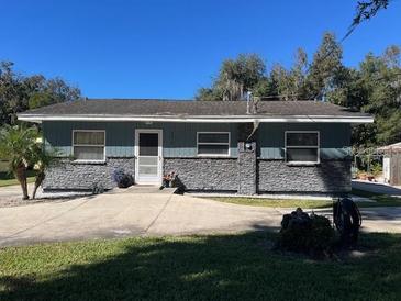 Ranch style home with stone accents and a spacious yard at 2478 Cr 447, Lake Panasoffkee, FL 33538