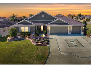 Attractive single-story home with a three-car garage and landscaped yard at 632 Kauska Way, The Villages, FL 32163