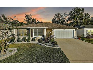 Attractive single-story home with landscaped yard and driveway at 4414 Cameo Cir, The Villages, FL 32163