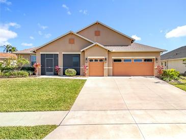 Attractive two-story home with a two-car garage and landscaped front yard at 16304 Spring View Ct, Clermont, FL 34711