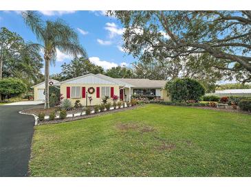 Ranch style home with mature landscaping and large yard at 1281 Gray Ct, Eustis, FL 32726