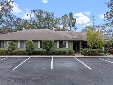 Green house exterior with parking and landscaping at 636 Mount Homer Rd # 636, Eustis, FL 32726