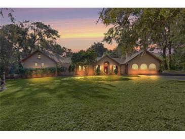 Beautiful ranch home with a large front yard and mature trees at 1600 Se 52Nd St, Ocala, FL 34480