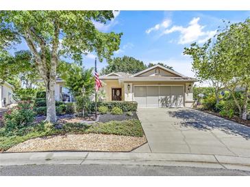 Charming single-story home with a landscaped yard and two-car garage at 8033 Sw 81St Loop, Ocala, FL 34476