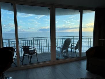 Breathtaking ocean view from condo balcony with comfortable seating at 2625 S Atlantic Ave # 9Ne, Daytona Beach, FL 32118