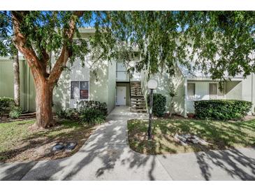 Building exterior with stairs and landscaping at 600 Bahia Cir # A, Ocala, FL 34472